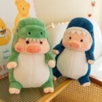 CHANCHO DISFRAZADO DE TIBURON Y DINO SIN RELLENO 65CM APROX