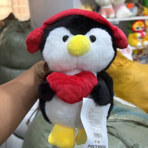 PINGUINO CORAZON AUDIFONO 22CM